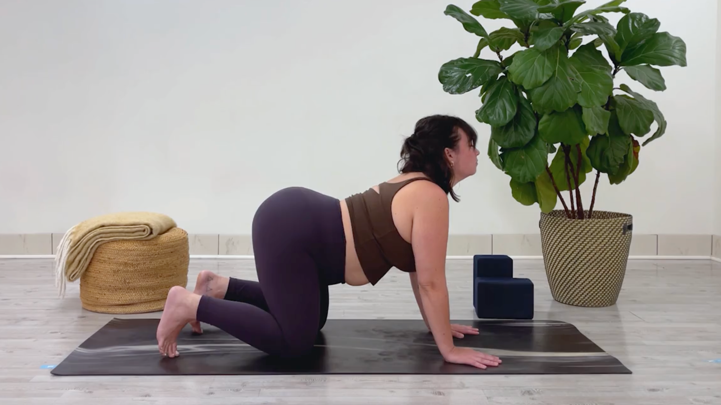 Yoga teacher Taylor Lorenz in Cow Pose, part of her 10-minute cool down yoga routine